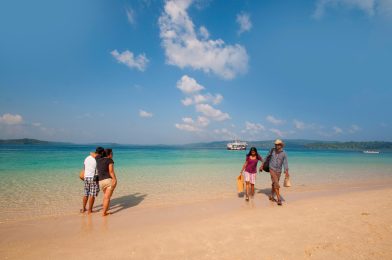 Couple enjoy a romantic moment at the scenic Jolly Buoy island, Andaman, India.